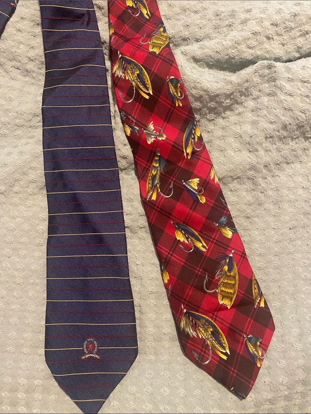 Two Tommy Hilfiger silk ties, fishing lures and classic stripe